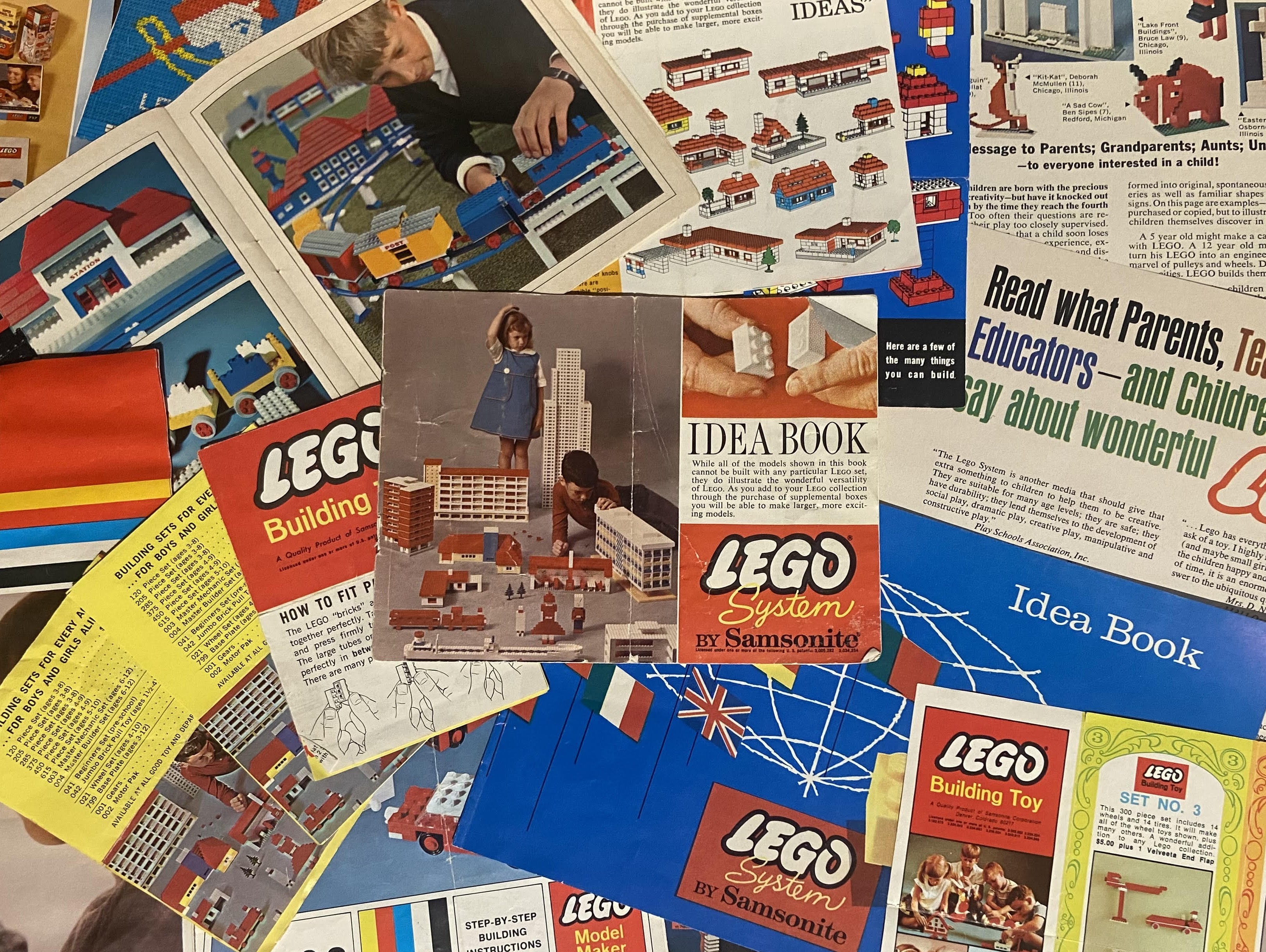 Same 1964 idea book centered in a pile of 1960s-70s paperwork
